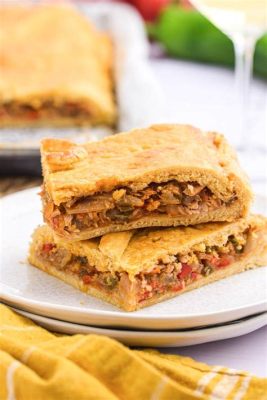  Empanada Gallega: A Bite-Sized Symphony of Savory Seafood and Buttery Pastry Perfection!