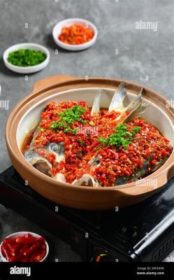  Steamed Fish Head with Chopped Chillies and Bean Sprouts! A Delectable Dish That Combines Sizzling Spice with Fresh Aquatic Delight